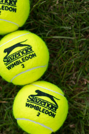 LONDON, UK - June 2021: Official wimbledon tennis Slazenger brand ball on grass