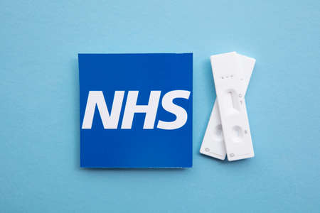 LONDON, UK - July 2021: NHS National health service logo with covid testsのeditorial素材