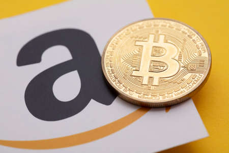 LONDON, UK - July 2021: Bitcoin cryptocurrency on an amazom e-commerce logoのeditorial素材