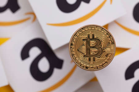 LONDON, UK - July 2021: Bitcoin cryptocurrency on an amazom e-commerce logoのeditorial素材