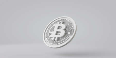 A white bitcoin cryptocurrency coin against a grey background. 3D Renderingの写真素材