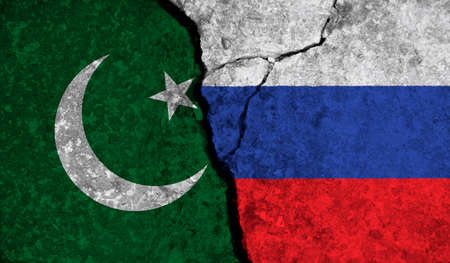 Political relationship between Pakistan and russia. National flags on cracked concrete backgroundの写真素材
