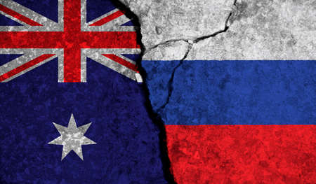 Political relationship between Australia and russia. National flags on cracked concrete backgroundの写真素材
