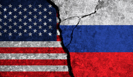 Political relationship between USA and russia. National flags on cracked concrete backgroundの写真素材