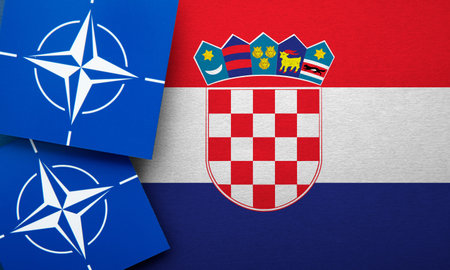 LONDON, UK - August 2022: NATO North Atlantic Treaty Organization military alliance logo on a Croatia flagのeditorial素材