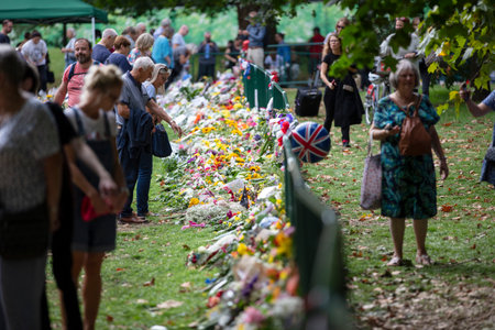 LONDON, UK - September 2022: Thousands of people lay flowers and cards in Green park in tribute to...
