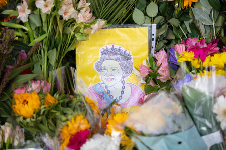 LONDON, UK - September 2022: Thousands of flowers, cards and messages are laid in Green park in...