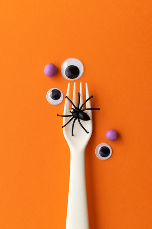Halloween meal concept. Fork with a spider and eyeballsの写真素材