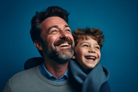 Happy father and son together against a blue background. Generative aiの素材