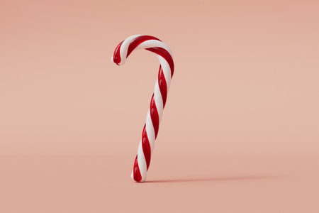 Christmas candy cane red and white festive sweet on a pink background. 3D Renderingの写真素材