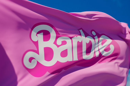 LONDON, UK - July 2023: Barbie doll logo on a flag. Barbie is a fashion doll made by Mattel. 3D Renderingのeditorial素材