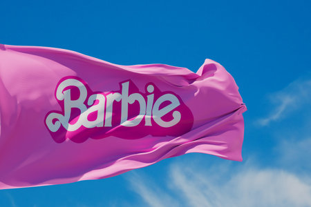 LONDON, UK - July 2023: Barbie doll logo on a flag. Barbie is a fashion doll made by Mattel. 3D Renderingのeditorial素材