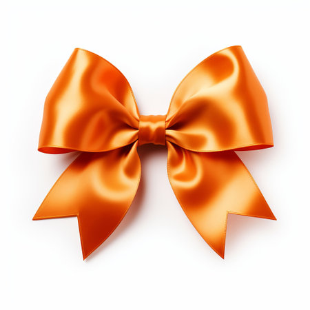 Realistic orange party gift bow decoration against a white backgroundの素材