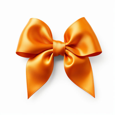 Realistic orange party gift bow decoration against a white backgroundの素材