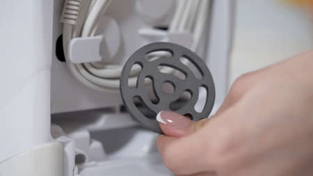Cutting plates for obtaining the different consistencies of minced meat. Electric mincer machine for...