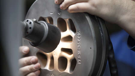 Engineer checks quality die for aluminium metal profiles production. Production of Complex lightweight extruded aluminium metal profiles, commonly used as material in construction and manufacturingの写真素材