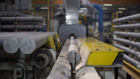 Aluminium extrusion production line factory. Production of Complex lightweight extruded aluminium metal profiles, commonly used as material in construction and manufacturingの写真素材