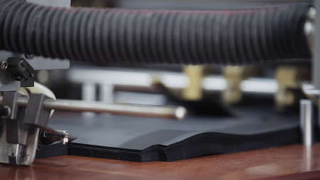 Automatic robotic Conveyor line for the production of package. Modern factory of production cardboard box. Manufacture of cardboard boxes from paper. Enterprise for production packageの写真素材