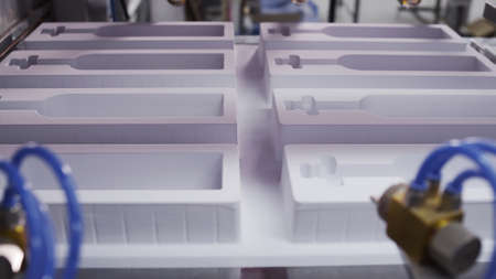 Create plastic package and packing. Machines create packing for bottles. Process of manufacturing...