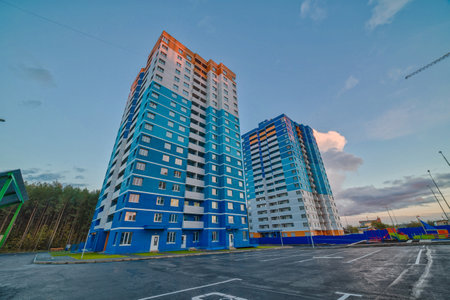 Apartment building with colorful facades. Modern minimalistic architecture. Modern and new apartment building. Multistoried modern, new and stylish living block of flats.の写真素材