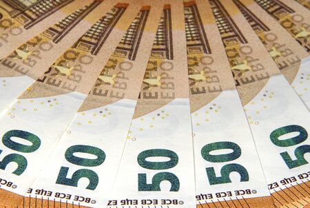 Fifty Euro banknotes of a new type close up. Money and finance.