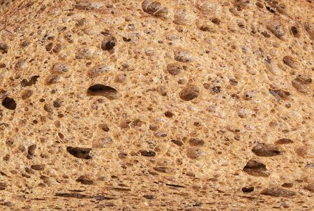 Texture of a piece of dark bread. Food and drink