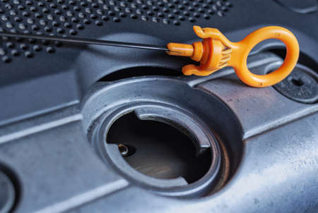 Engine oil filler tube with dipstick. Car repair and maintenanceの写真素材