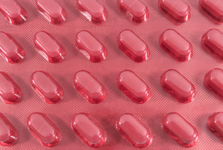 Medical pills packed in red blister. medicines and healthcareの写真素材