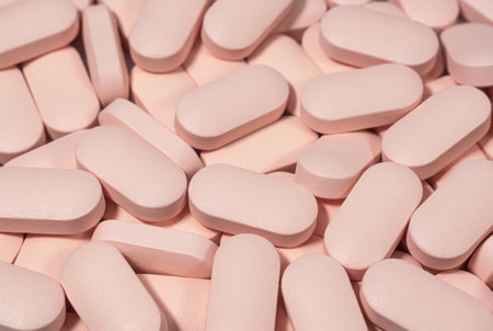 Light pink pills as a background. Medicines, pharmacology and healthcareの写真素材