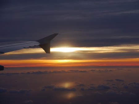 Sunset sky, view from inside aeroplaneの写真素材