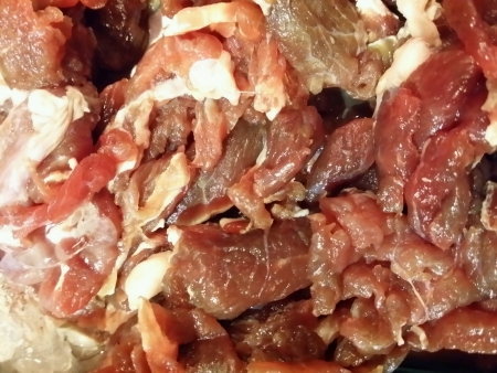 Raw and juicy marinated beef slices ready for steamboatの素材