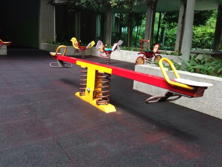 Spring balance on playground in a condominiumの素材