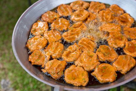 Fried fish-paste balls in the pan that is friedの写真素材