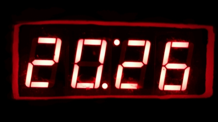 Red digital numbers with dark background の素材