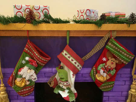 Christmas decorations on a fireplace の素材