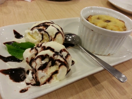 Warm apple crumble served with chocolate topped vanilla ice creamの素材