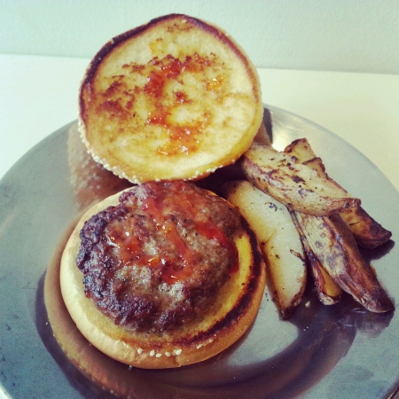 Home made delicious lamb burger served with potato wedgesの素材