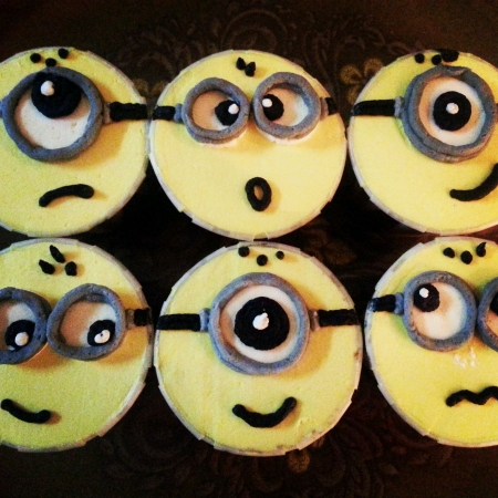 Cute little minions cupcakes with different expressionsの素材
