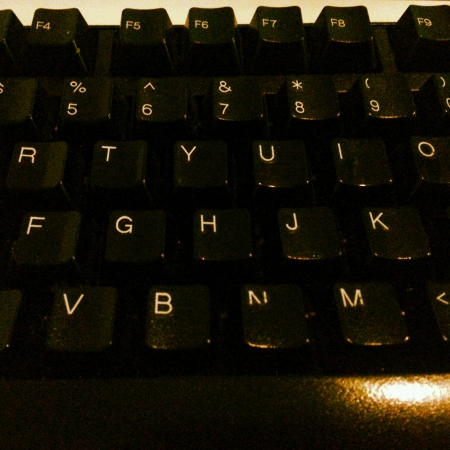 Close up of keyboard under dim lightingの素材