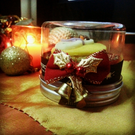 Cute chick lemon flavored cupcake wrapped up in classy Christmas bottleの素材