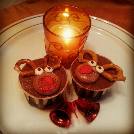 Chocolate rain deer Cupcakes with dimly lighted fragrant candleの素材