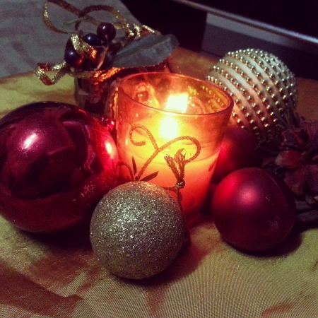 Christmas ornaments with lighted fragrant candleの素材