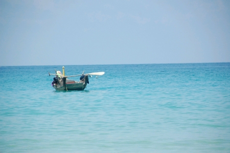 Fishing boat on blue seaの素材