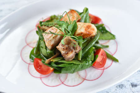 grilled fish and meat fillet, grilled vegetables, lettuce, asparagus, tomatoes, spinach