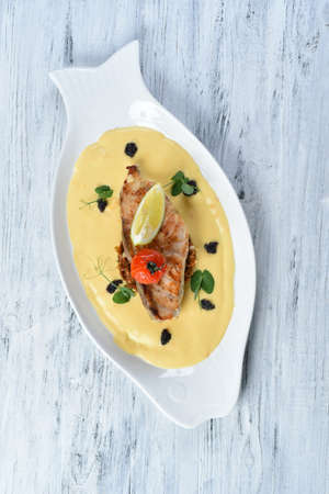 grilled fish fillet with vegetable puree, tomatoes and lemon