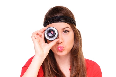 woman looks in the camera lens. shows the internal mechanism. positively smiling. close-upの写真素材