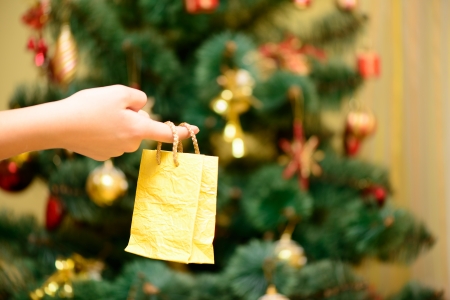 yellow gift package decorations in hand. new yearの写真素材