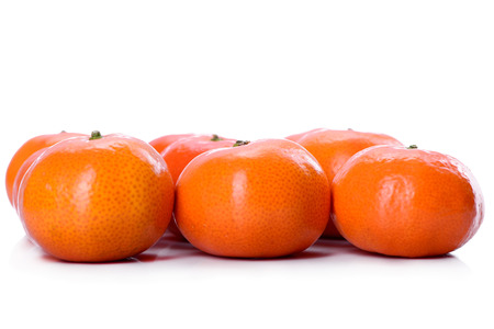 fresh mandarin and orange close-up on a white background