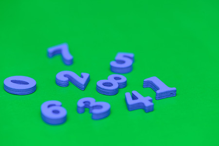 Pile of child toy wooden color letters