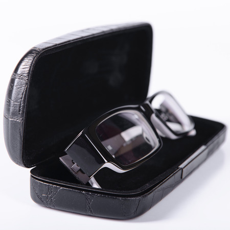 optical glasses on a light gray background in a caseの写真素材